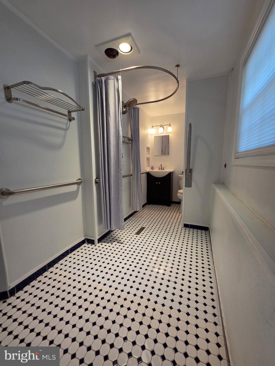 401 Cardinal Road Beverly, NJ 08010 - Photo 35 of 35 a bathroom with a sink and a mirror
