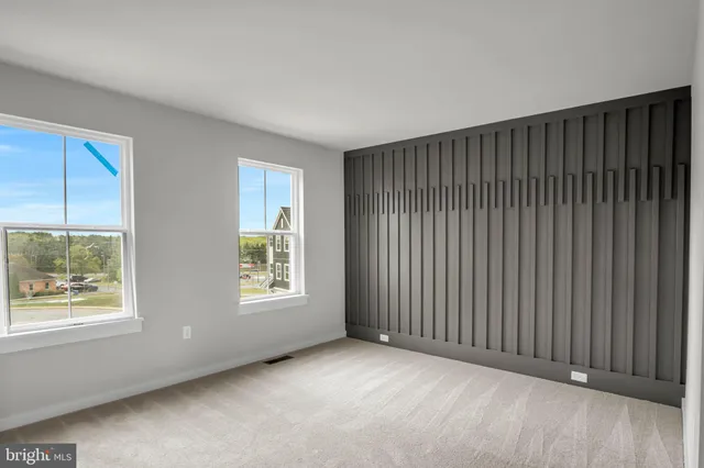 a view of an empty room with windows