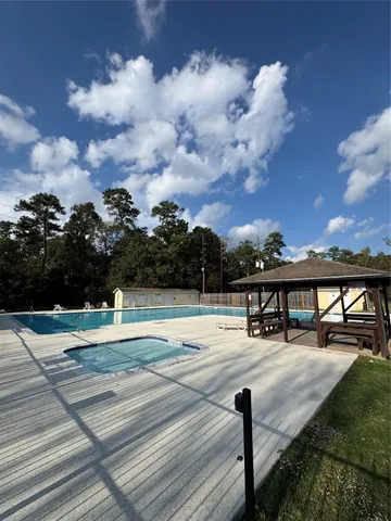 a view of swimming pool with seating space