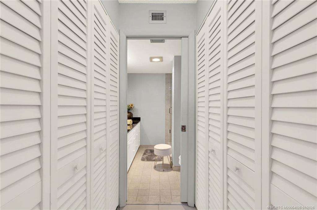 1950 Southwest Palm City Road, Unit 8106 Stuart, FL 34994 - Photo 29 of 54 a bathroom with a shower and a sink