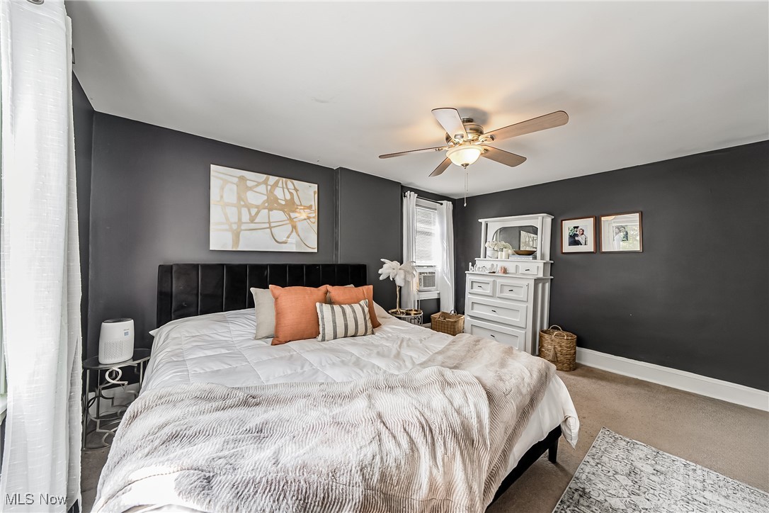 1128 Quilliams Road Cleveland, OH 44121 - Photo 12 of 23 Bedroom featuring carpet floors and a ceiling fan