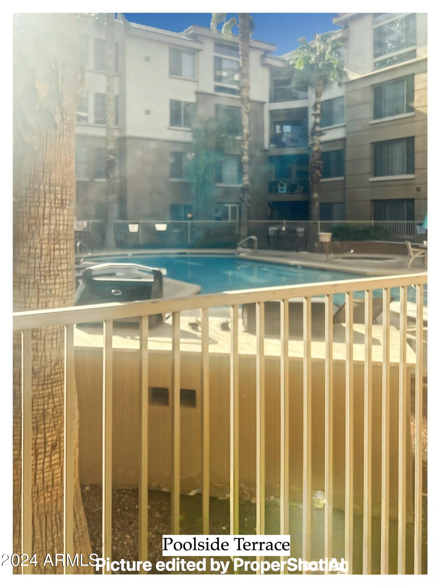 1701 East Colter Street, Unit 148 Phoenix, AZ 85016 - Photo 12 of 13 a view of a glass building from a view of a glass door
