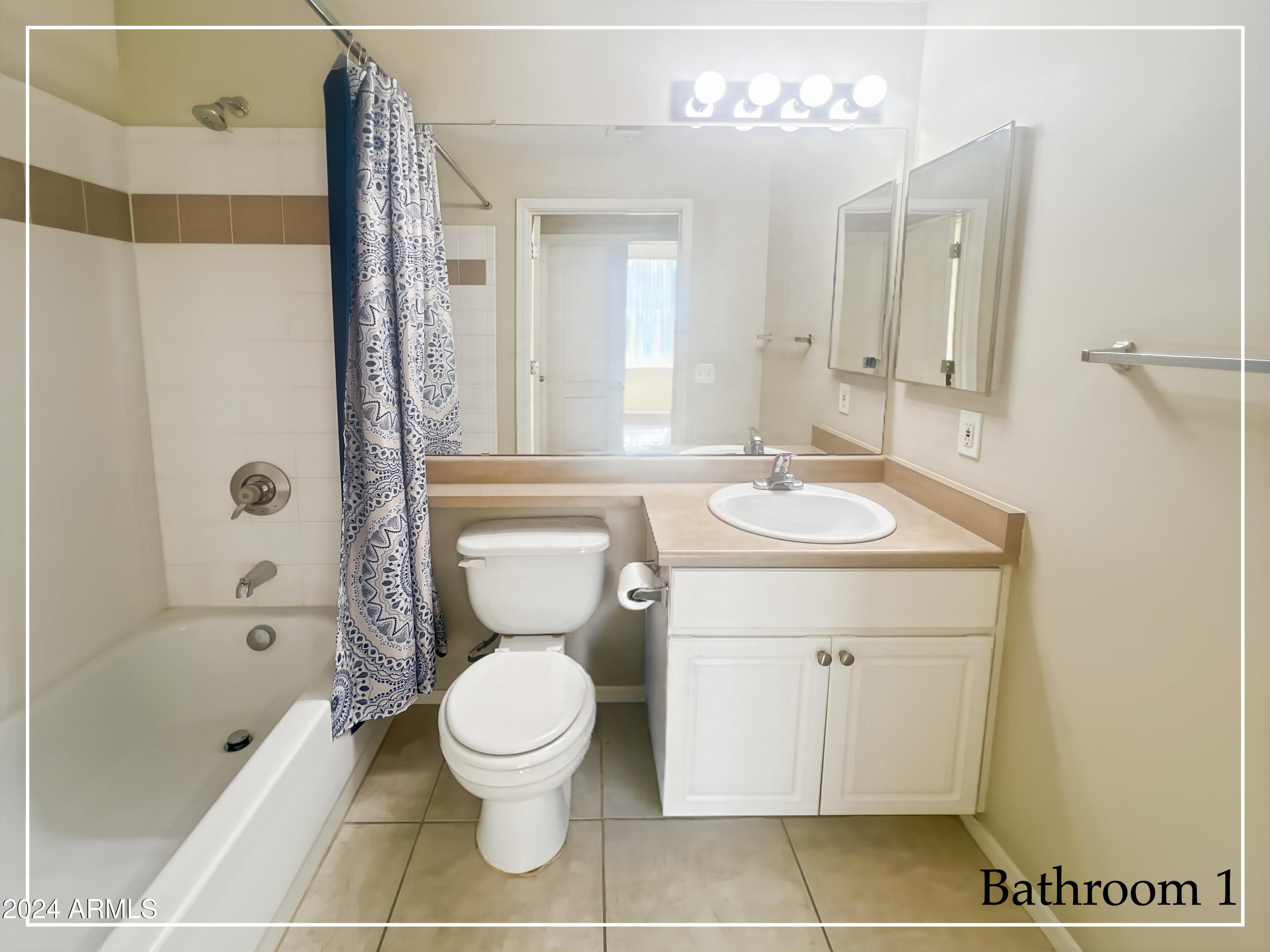 1701 East Colter Street, Unit 148 Phoenix, AZ 85016 - Photo 8 of 13 a bathroom with a sink a toilet and shower