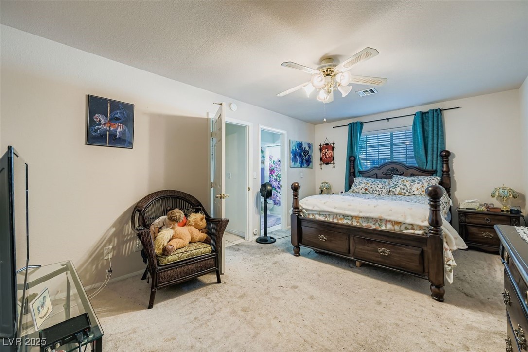 6800 West Elm Creek Drive, Unit 103 Las Vegas, NV 89108 - Photo 14 of 22 Carpeted bedroom featuring a ceiling fan