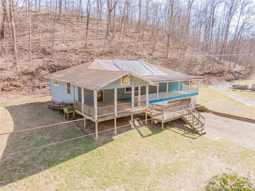 304 Baker Road Vandergrift, PA 15690 - Photo 3 of 18 an aerial view of a house with swimming pool and wooden fence