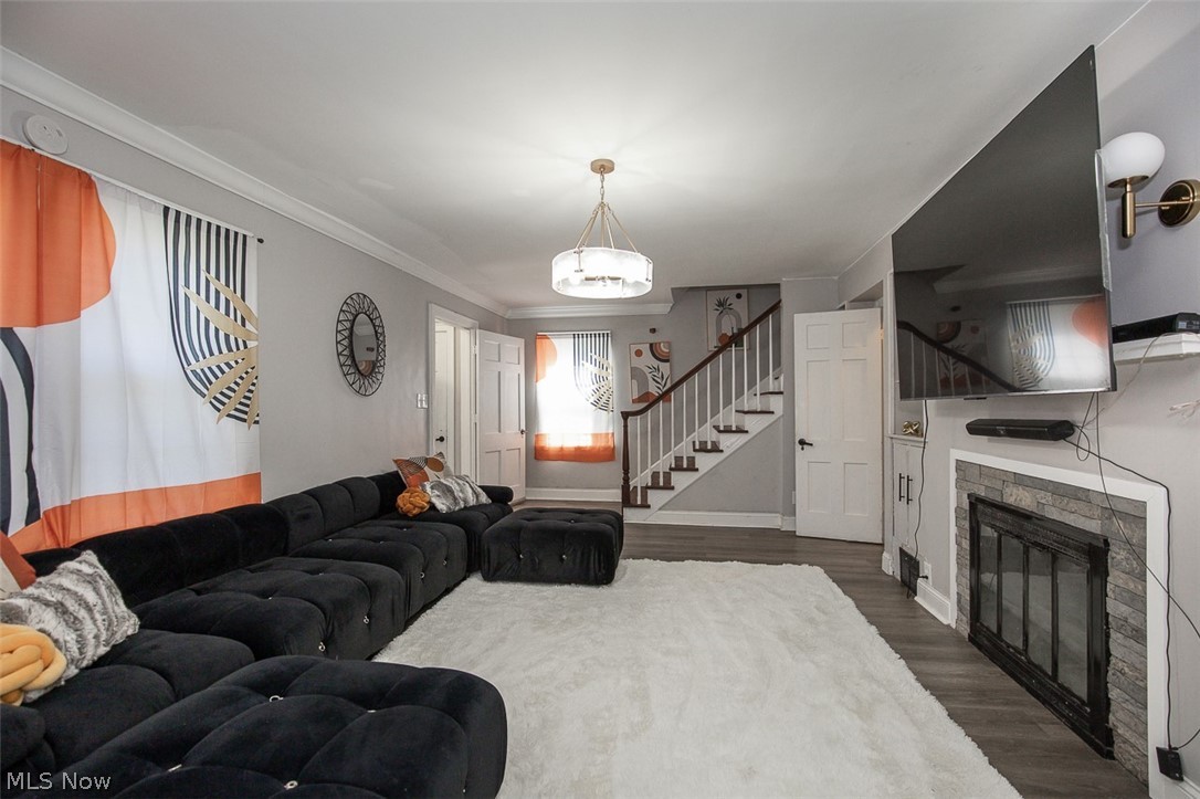 982 Roanoke Road Cleveland Heights, OH 44121 - Photo 4 of 33 Living room featuring a fireplace and staircase.