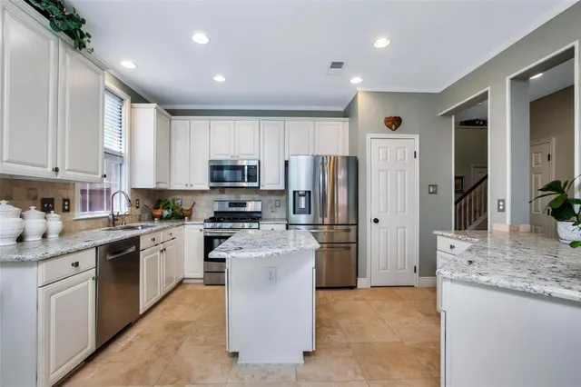 a kitchen with a stove a refrigerator and a stove