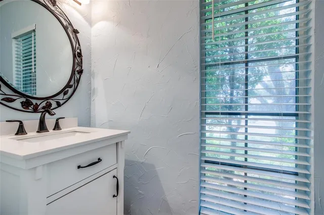 a view of a dining room with furniture and a potted plant