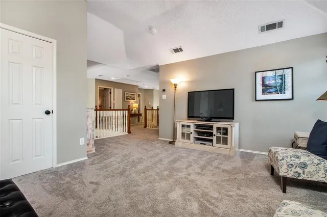 a bathroom with a double vanity sink mirror and shower