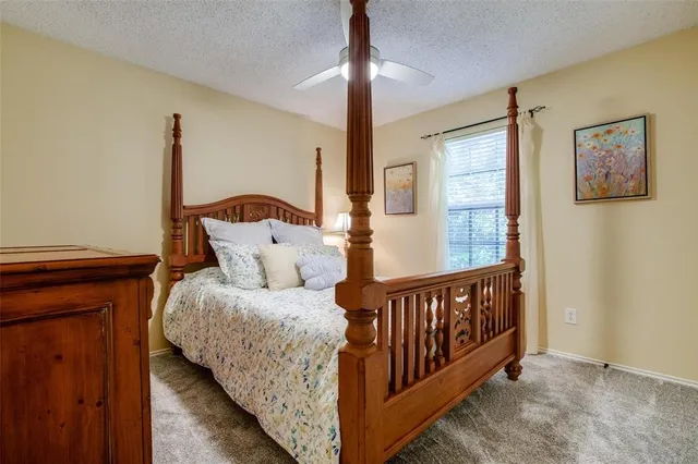 a living room with furniture gym equipment and a large window