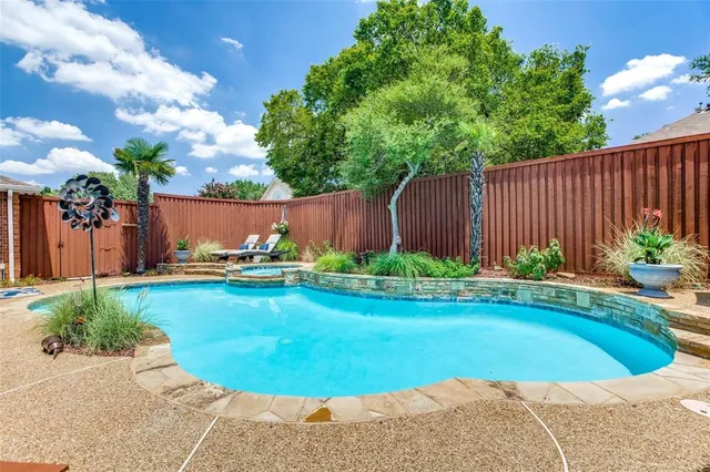 a view of a swimming pool and lounge chair