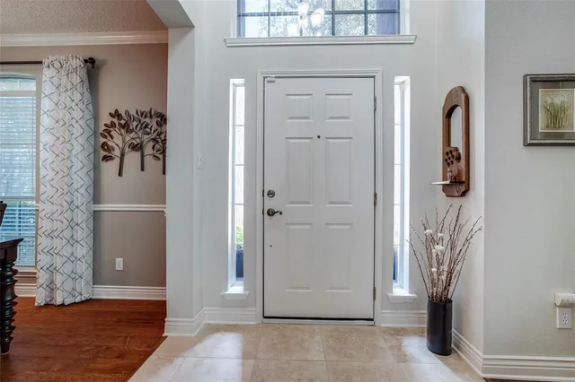 a view of a door and chair in a room