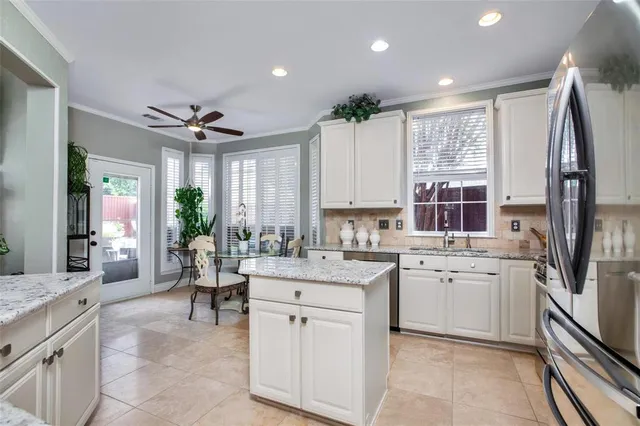 a open kitchen with stainless steel appliances granite countertop a sink stove and refrigerator