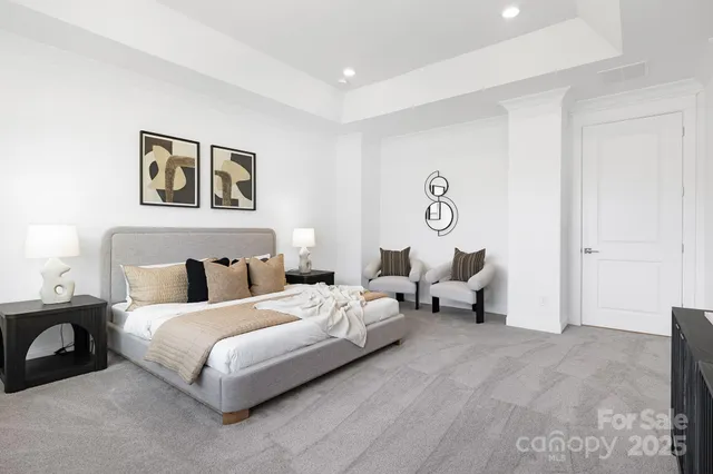 a bedroom with bed and a couch