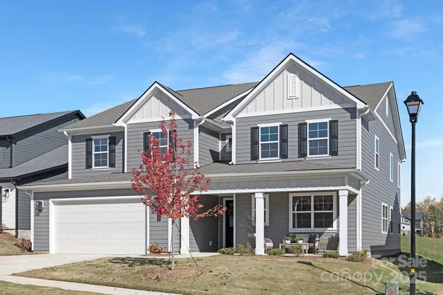 a front view of a house with yard