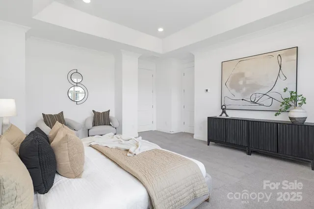 a bedroom with bed and furniture