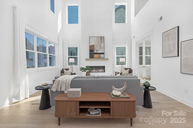 a living room with furniture and flat screen tv