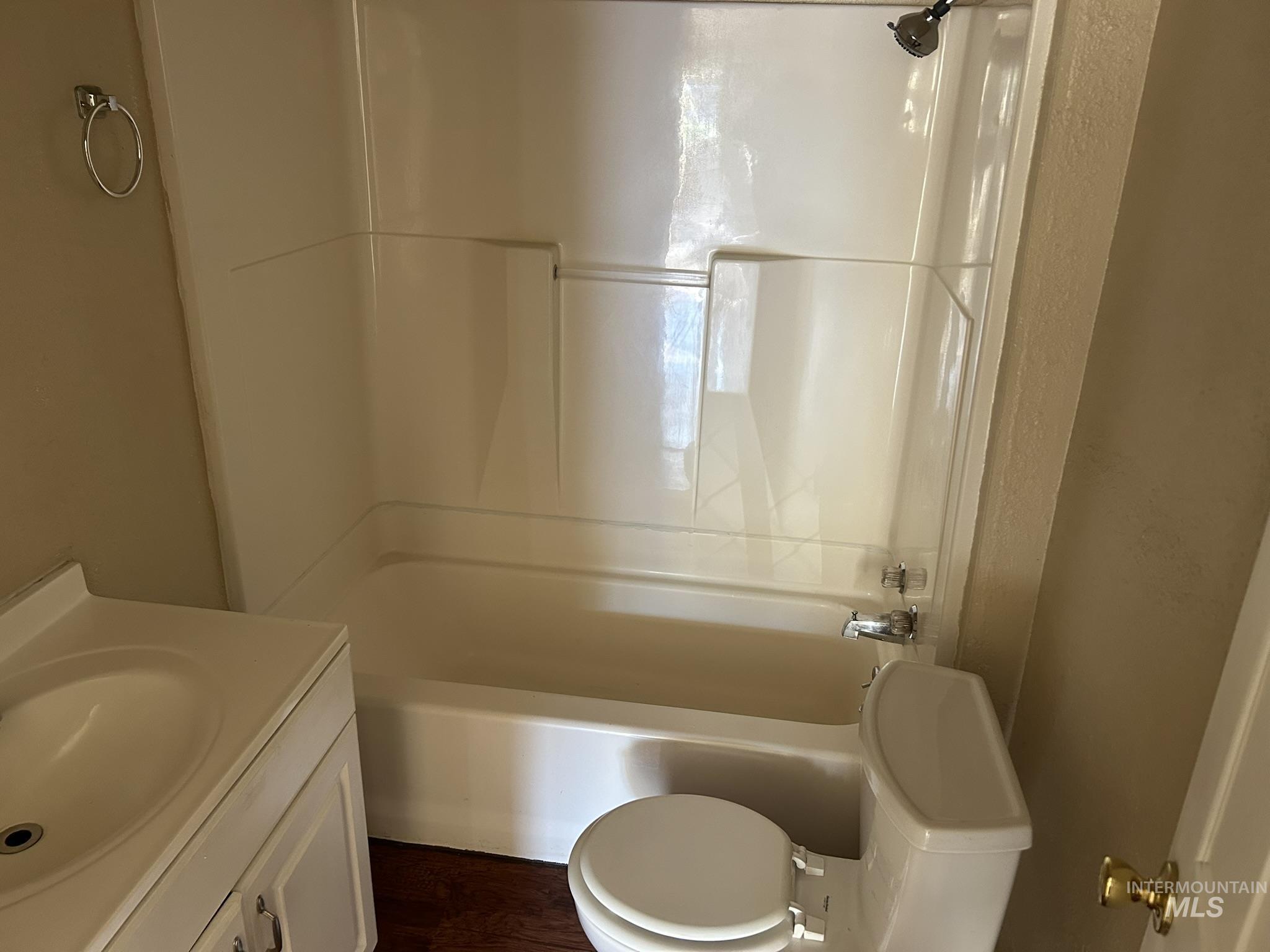 1413 7th Avenue Lewiston, ID 83501 - Photo 8 of 15 Bathroom featuring vanity, tub / shower combination, and dark wood finished floors