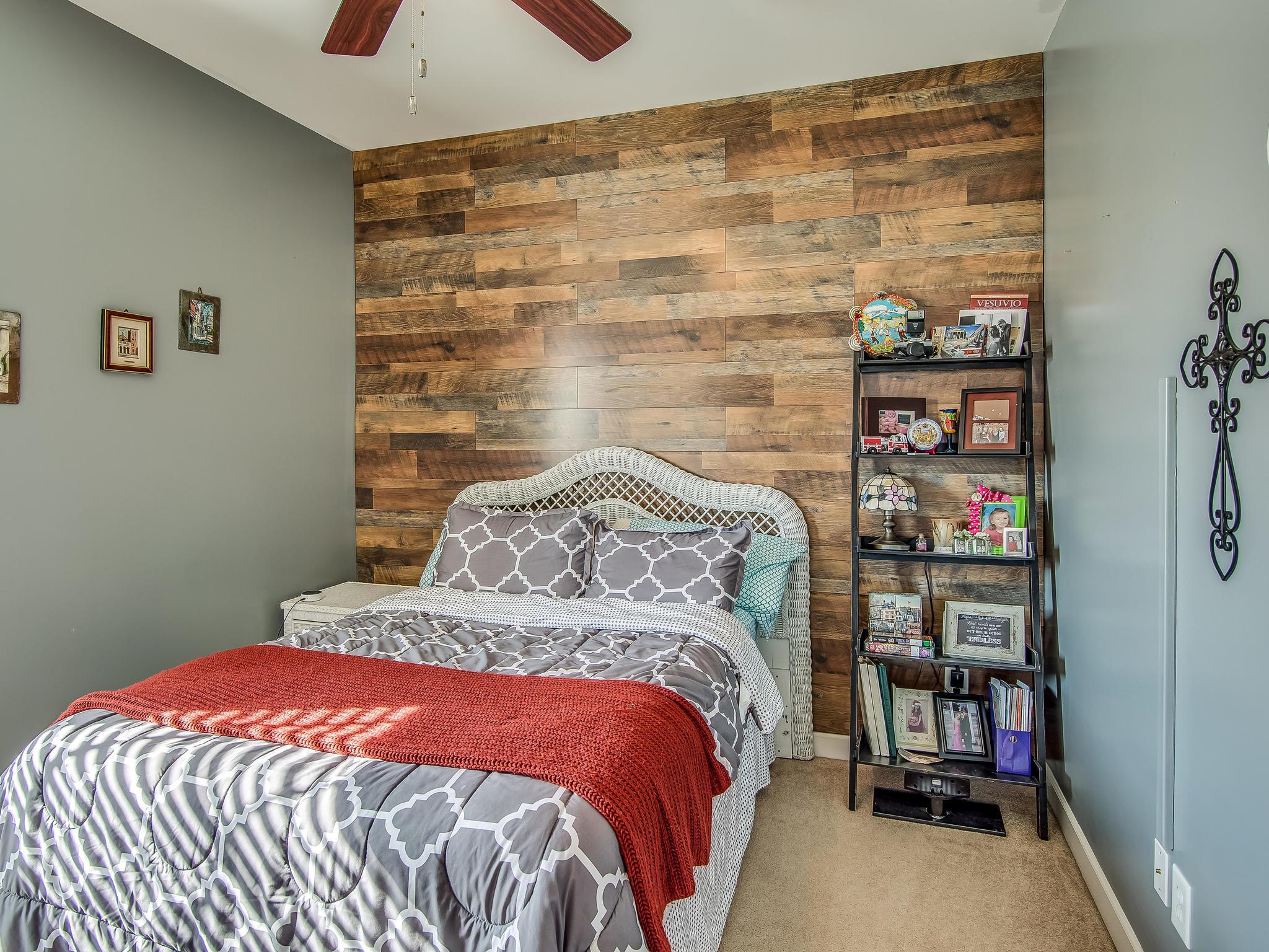 413 Reagan Road Mount Juliet, TN 37122 - Photo 22 of 30 a bedroom with a bed and a wall painting