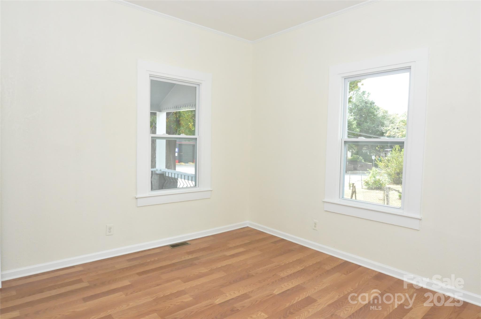 538 Pinckney Road Chester, SC 29706 - Photo 14 of 33 an empty room with wooden floor and windows