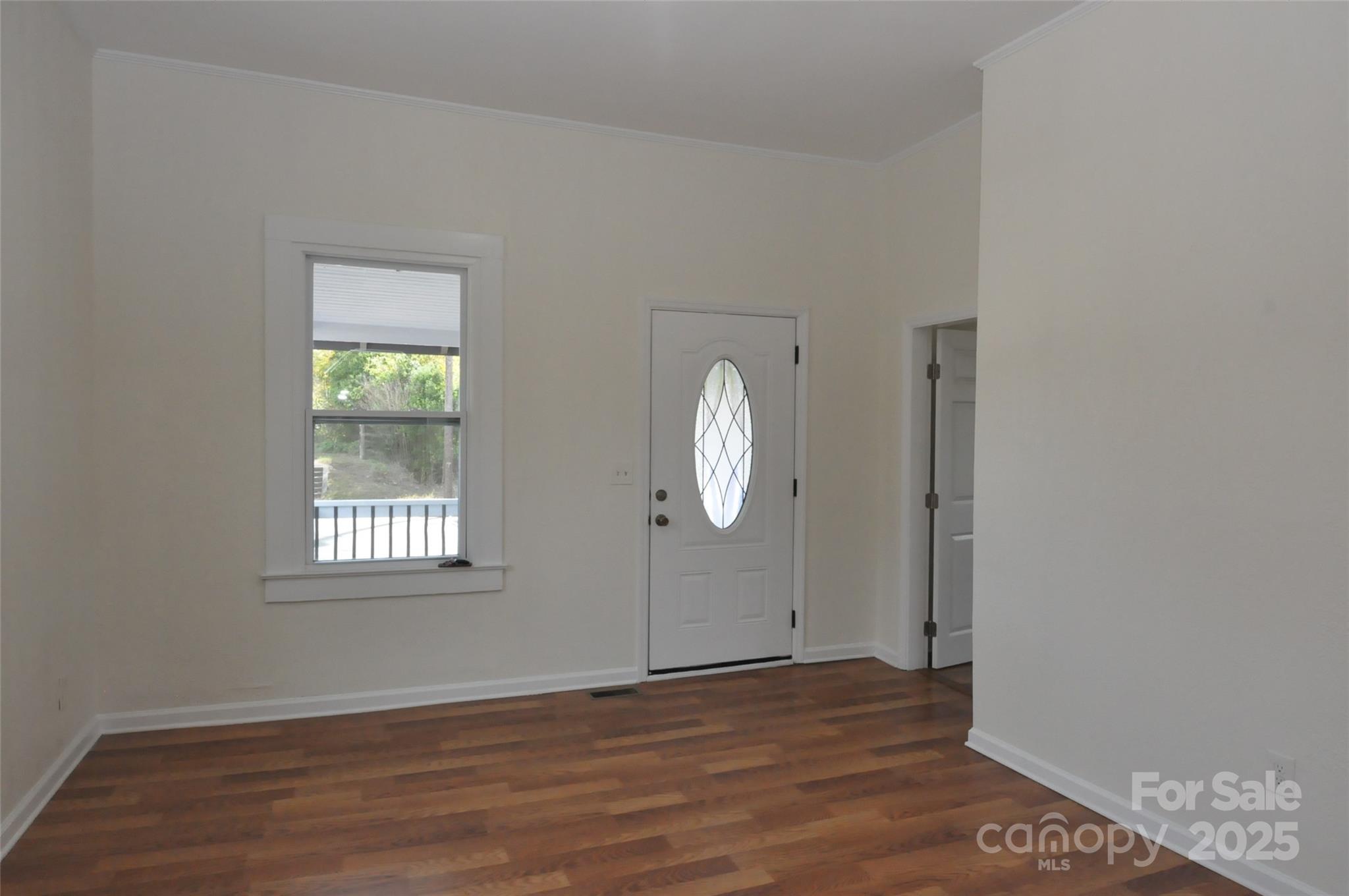 538 Pinckney Road Chester, SC 29706 - Photo 16 of 33 a view of an empty room with wooden floor and a window