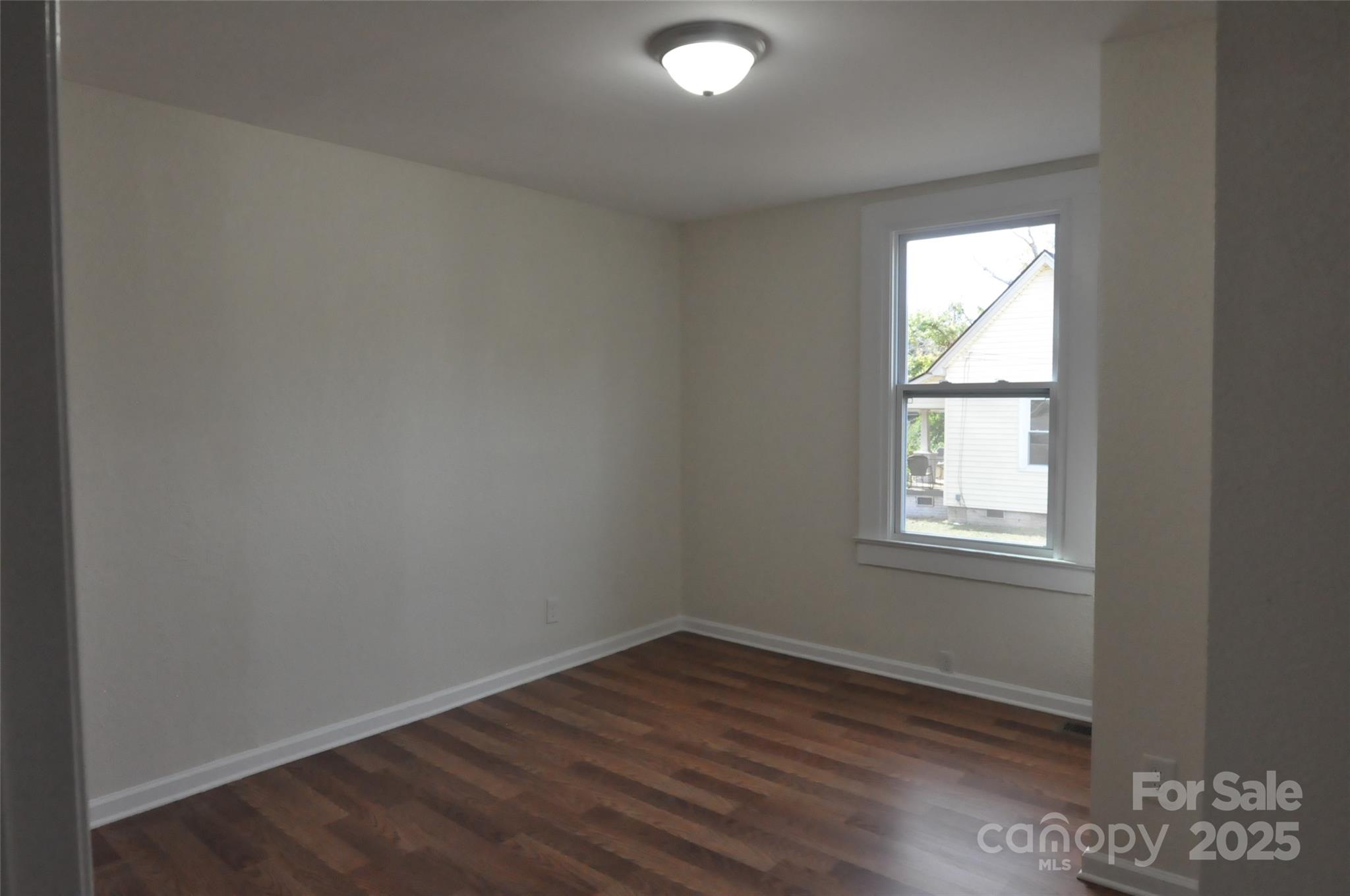 538 Pinckney Road Chester, SC 29706 - Photo 18 of 33 an empty room with wooden floor and windows