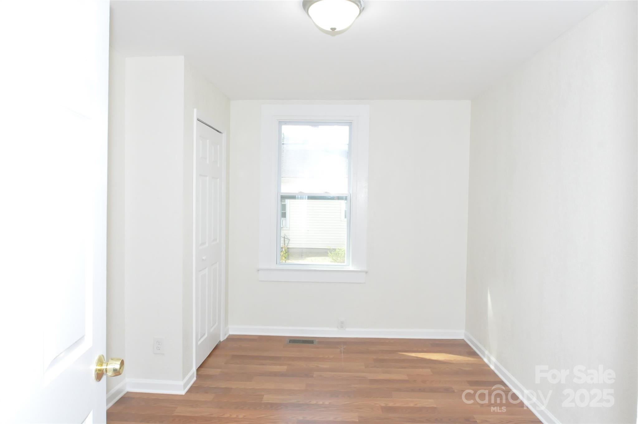 538 Pinckney Road Chester, SC 29706 - Photo 20 of 33 a view of an empty room with wooden floor and a window