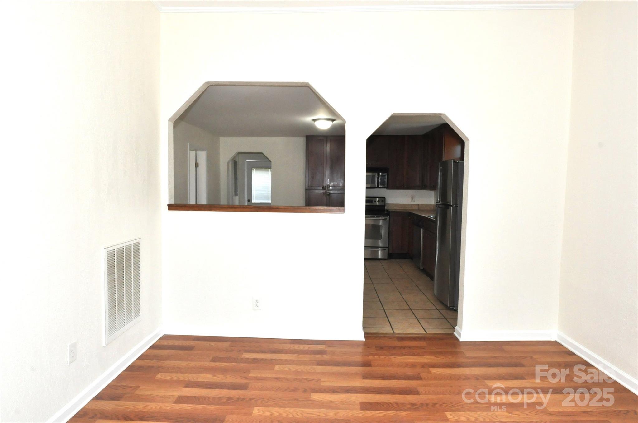 538 Pinckney Road Chester, SC 29706 - Photo 24 of 33 a view of a hallway with wooden floor and a large window