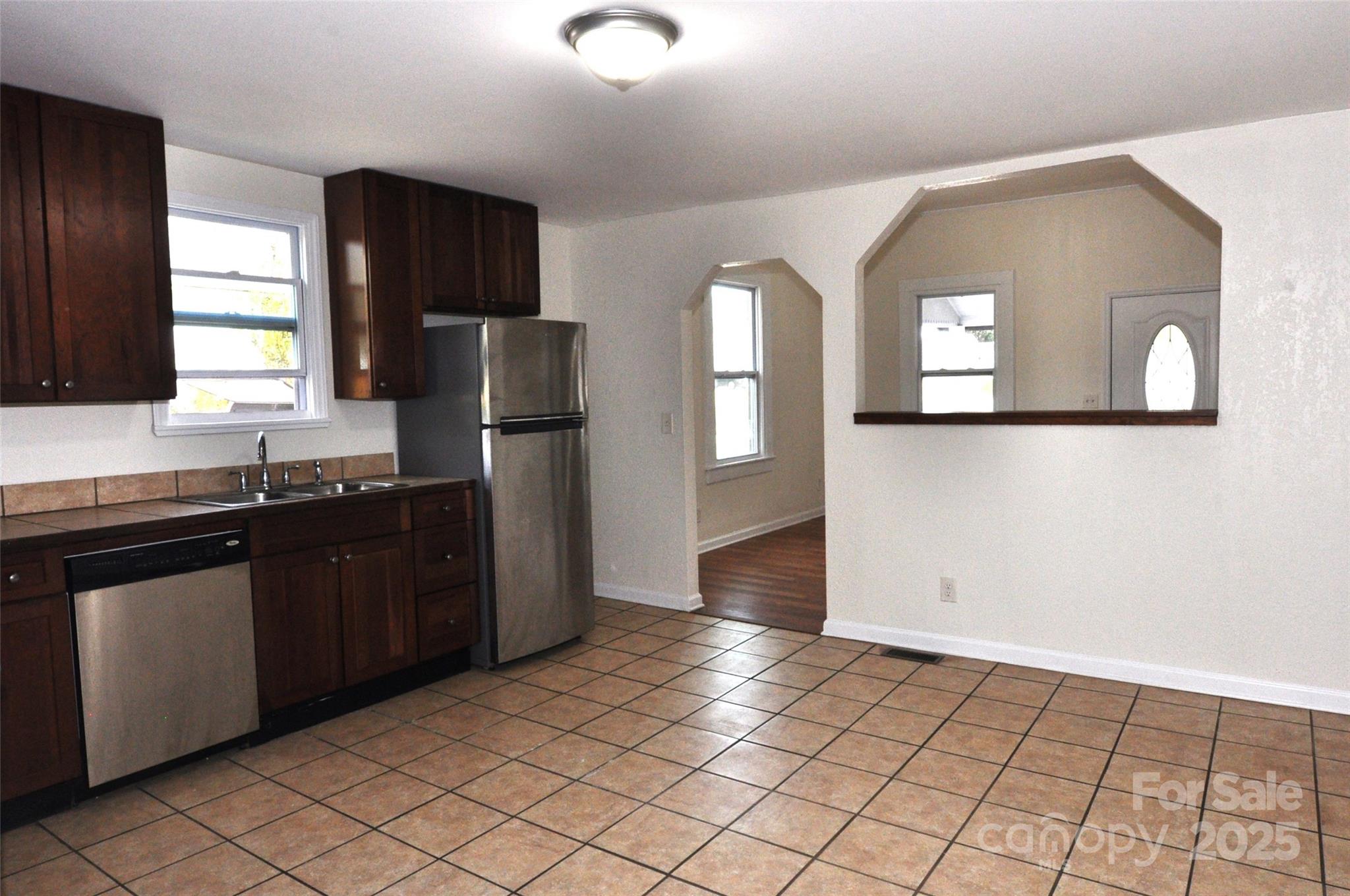 538 Pinckney Road Chester, SC 29706 - Photo 9 of 33 a kitchen with a sink a refrigerator and wooden cabinets
