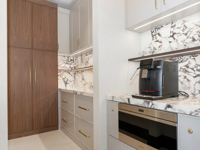 a kitchen with a refrigerator and cabinets