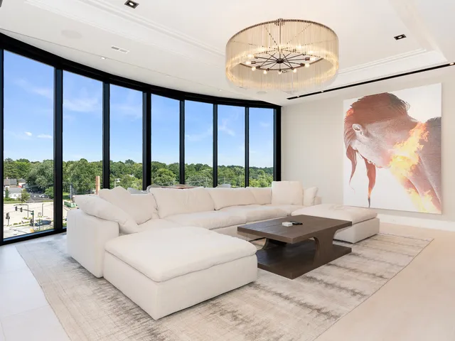 a bedroom with a large bed and a flat screen tv