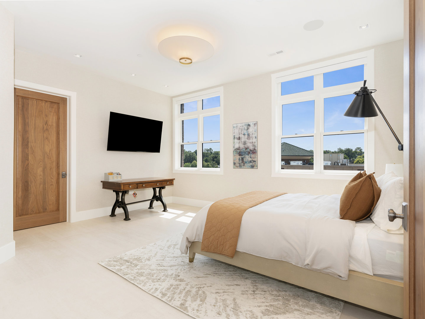 10 Illinois Street, Unit 5A St. Charles, IL 60174 - Photo 31 of 46 a bedroom with a bed and a flat screen tv