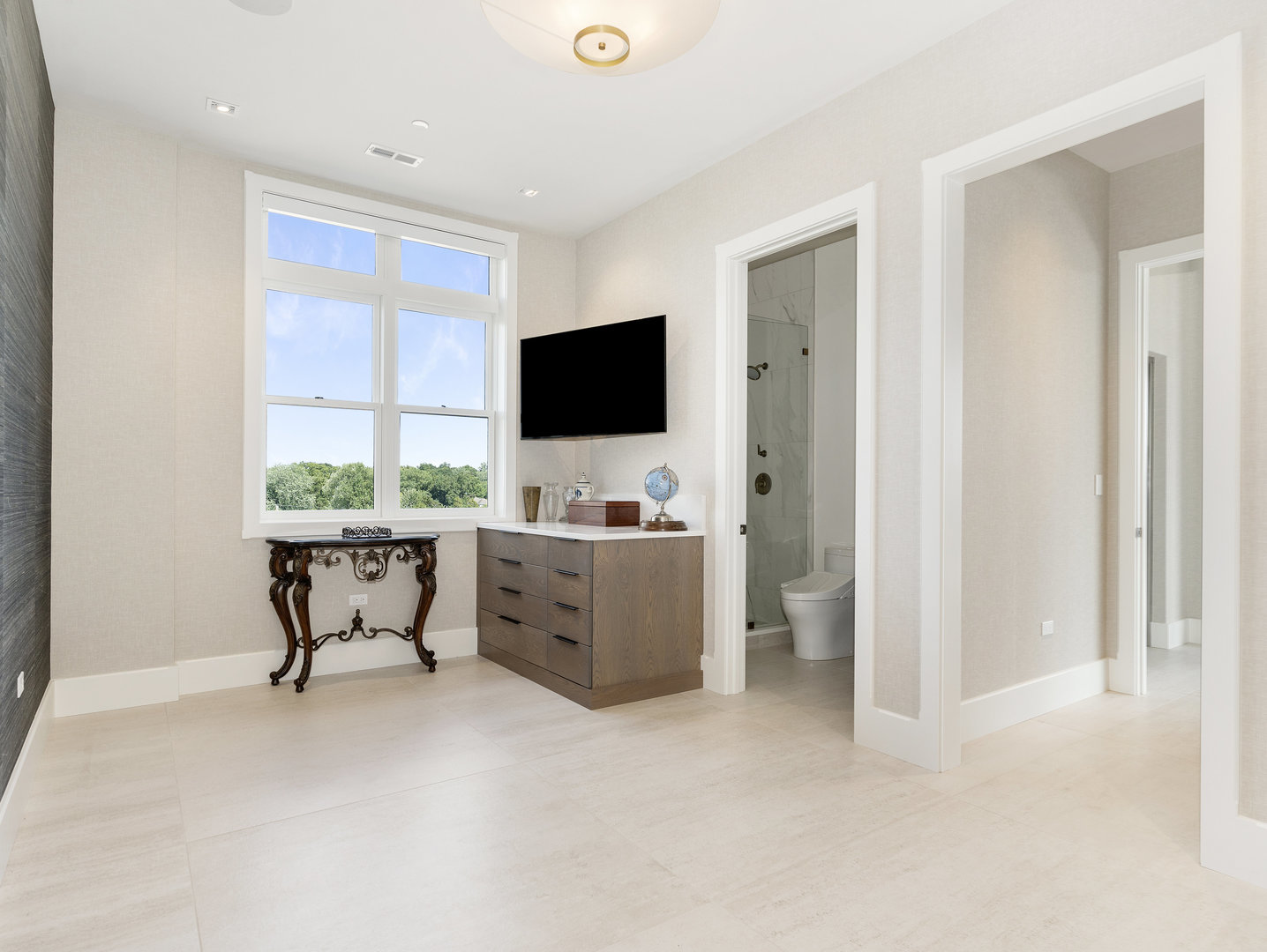 10 Illinois Street, Unit 5A St. Charles, IL 60174 - Photo 35 of 46 a living room with furniture and a flat screen tv