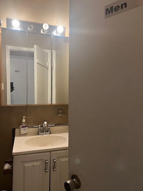 4026 Tioga Street Dallas, TX 75241 - Photo 12 of 13 a bathroom with a sink and a mirror