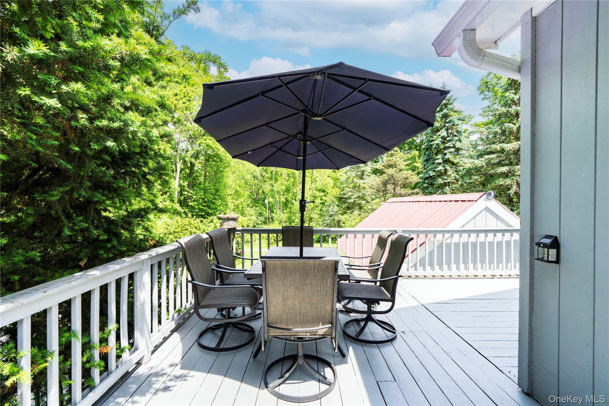 10 Pilgrims Progress Road Rhinebeck, NY 12572 - Photo 9 of 31 The Extensive Decking Provides Multiple Sitting and Dining Areas
