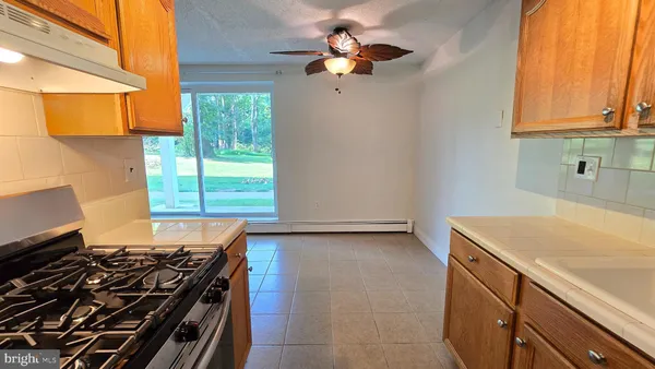 a utility room with a sink and a window
