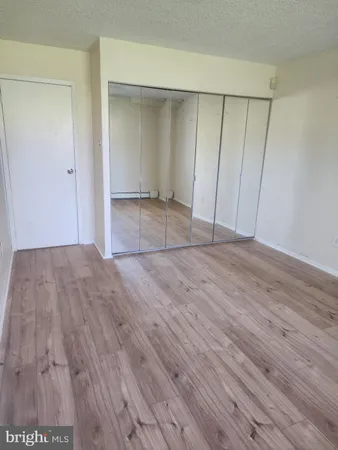 a view of kitchen and wooden floor