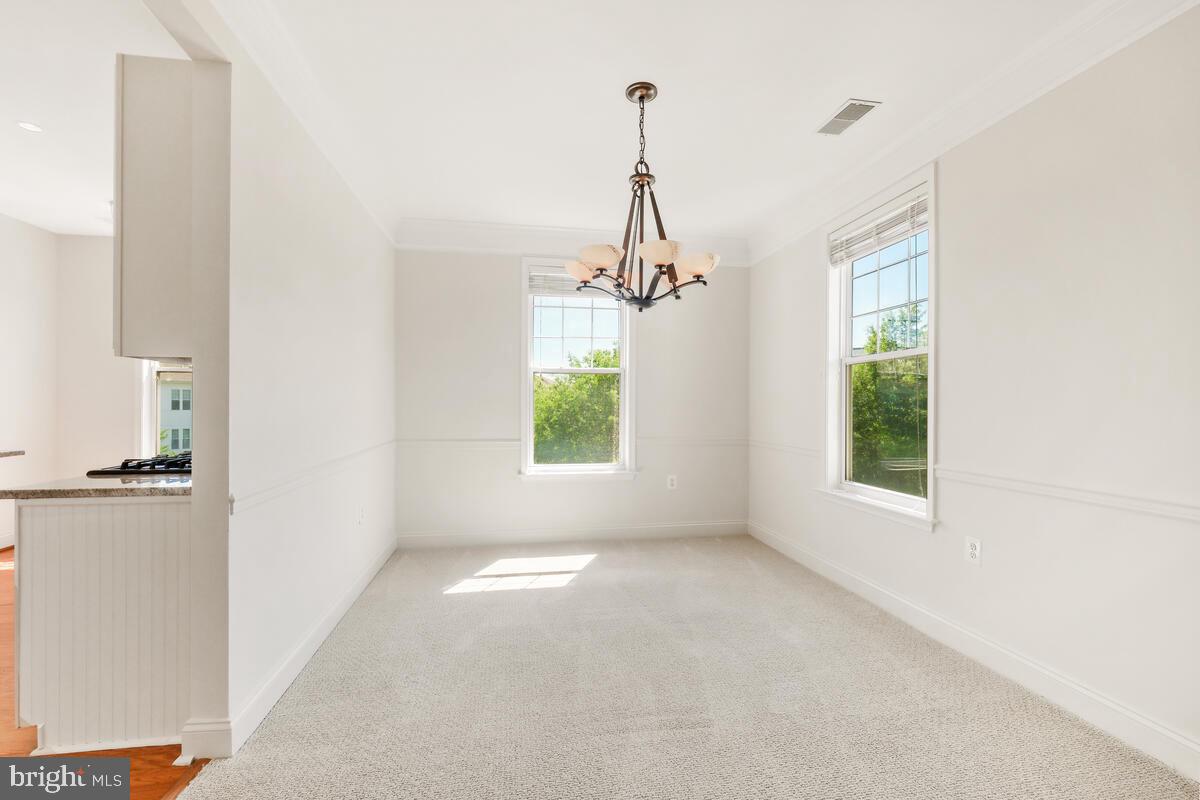 130 Chevy Chase Street, Unit 404 Gaithersburg, MD 20878 - Photo 19 of 39 a view of a room with windows and a window