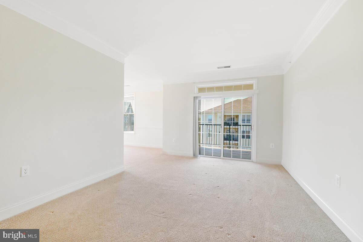 130 Chevy Chase Street, Unit 404 Gaithersburg, MD 20878 - Photo 21 of 39 a view of an empty room with a window
