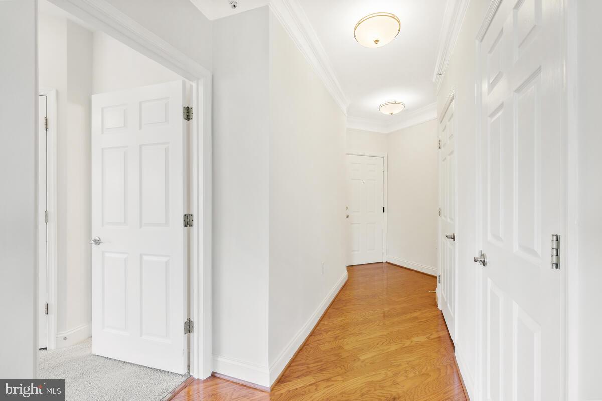 130 Chevy Chase Street, Unit 404 Gaithersburg, MD 20878 - Photo 22 of 39 a view of a bedroom with wooden floor