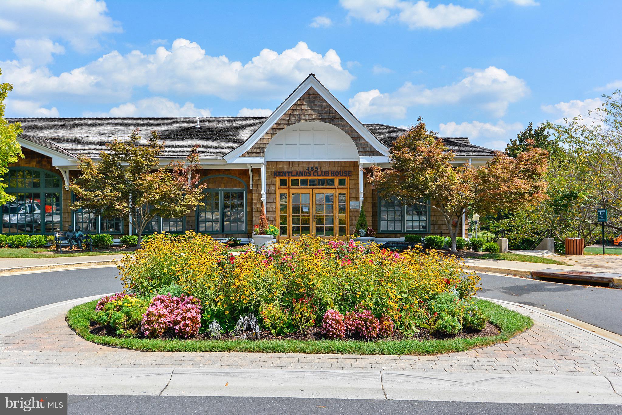 130 Chevy Chase Street, Unit 404 Gaithersburg, MD 20878 - Photo 30 of 39 a front view of a house with a yard