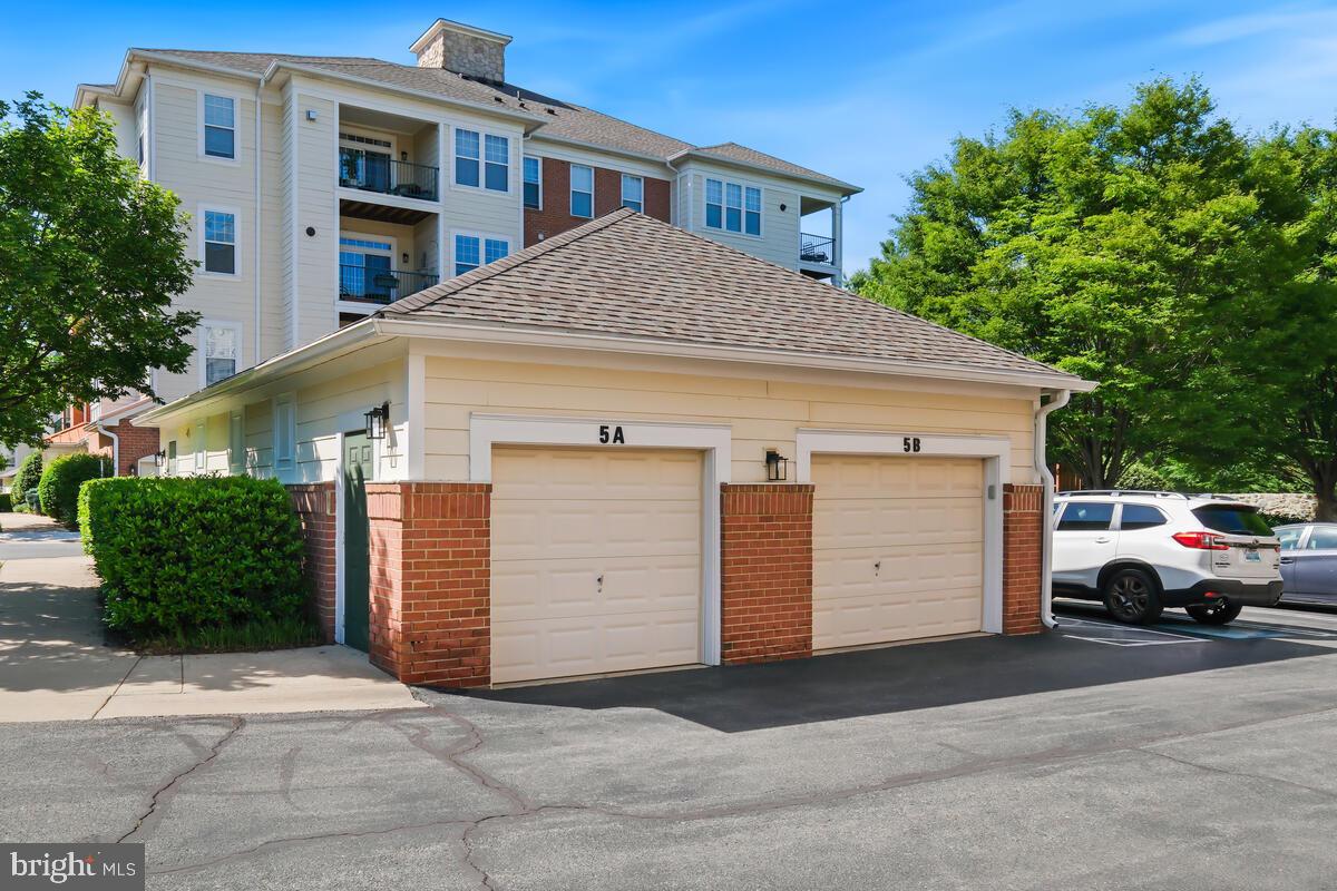 130 Chevy Chase Street, Unit 404 Gaithersburg, MD 20878 - Photo 4 of 39 a view of a house with a parking space