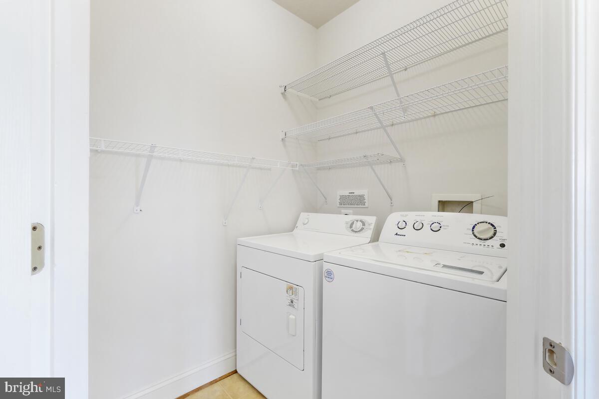 130 Chevy Chase Street, Unit 404 Gaithersburg, MD 20878 - Photo 6 of 39 a utility room with dryer and washer