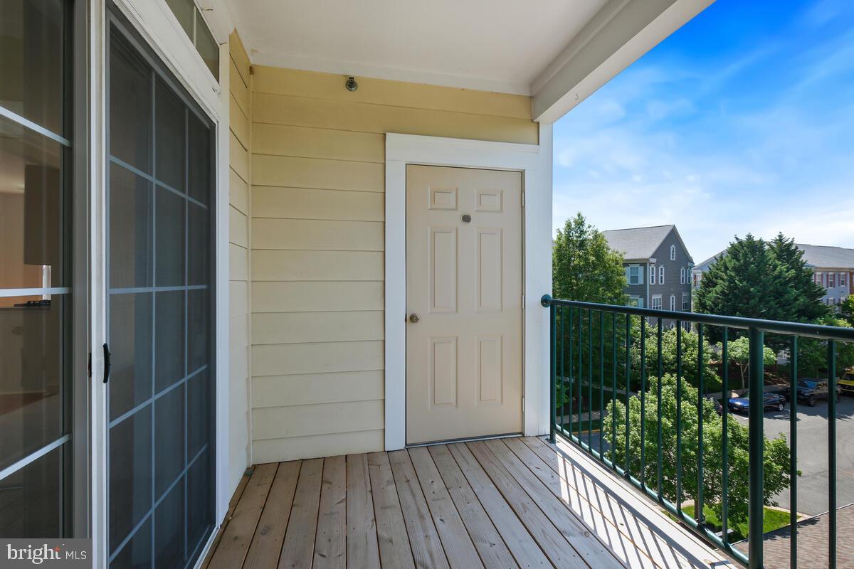 130 Chevy Chase Street, Unit 404 Gaithersburg, MD 20878 - Photo 7 of 39 a view of balcony with wooden floor