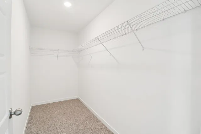 a bathroom with a shower sink and mirror