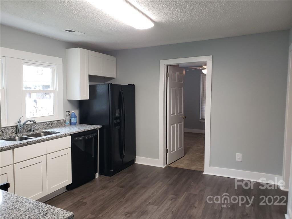 473 Liberty Drive Southwest Concord, NC 28027 - Photo 14 of 19 a kitchen with a refrigerator and a sink