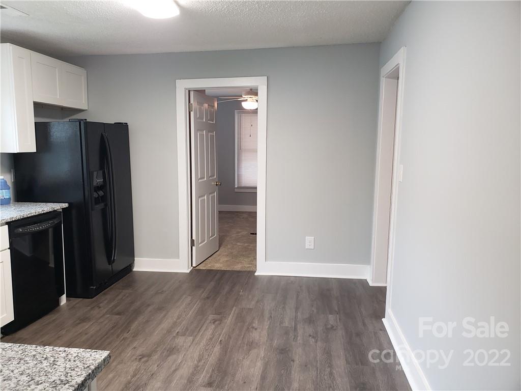 473 Liberty Drive Southwest Concord, NC 28027 - Photo 15 of 19 a view of a kitchen from a hallway