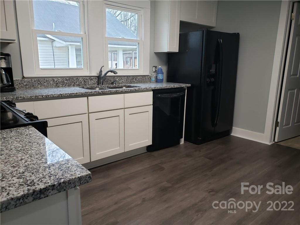 473 Liberty Drive Southwest Concord, NC 28027 - Photo 19 of 19 a kitchen with stainless steel appliances granite countertop a refrigerator and a sink