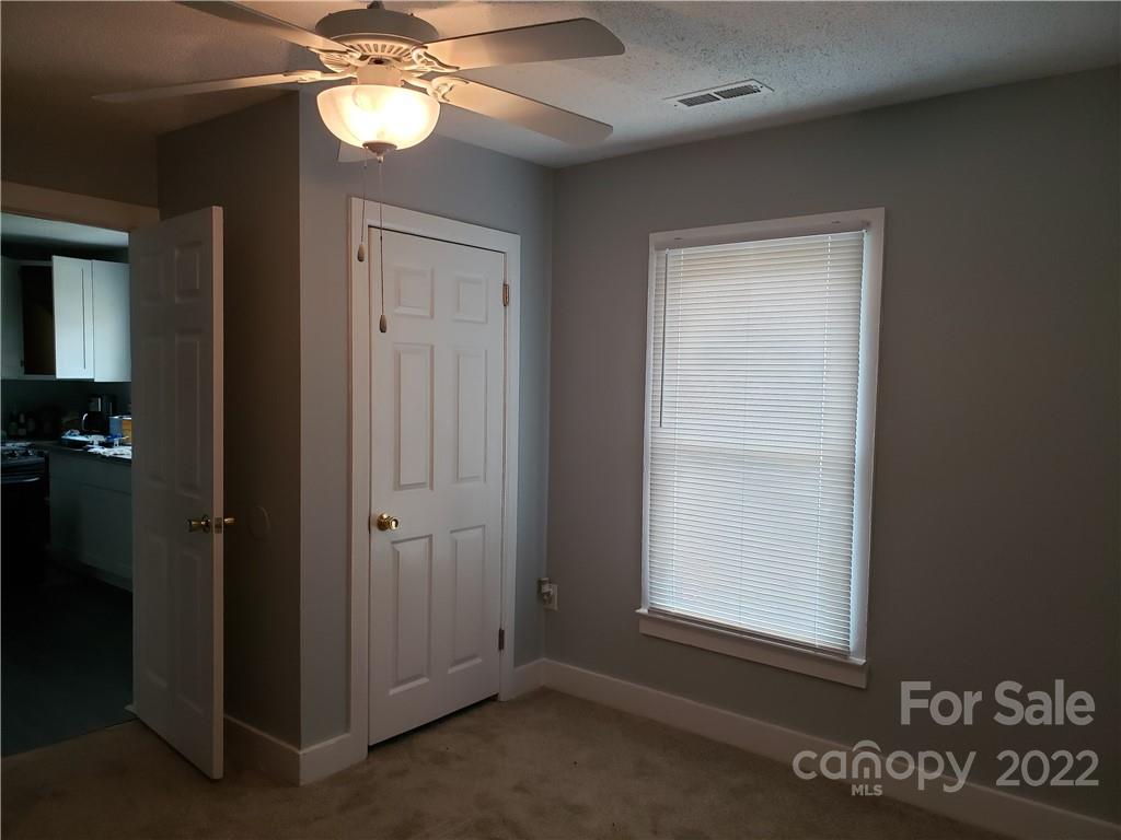 473 Liberty Drive Southwest Concord, NC 28027 - Photo 5 of 19 an empty room with windows and fan