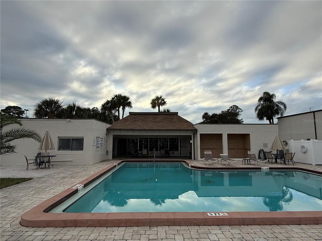 7701 Starkey Road, Unit 703 Seminole, FL 33777 - Photo 17 of 23 a view of a house with a swimming pool